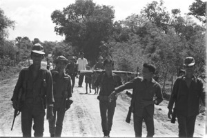 Men of the 66th Popular Force Platoon on patrol in Nhi Tan hamlet; Gia Dinh Province.