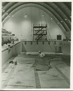 Builders working on the pool inside the Linkletter Natatorium, 1967