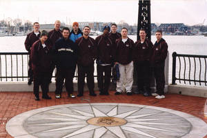 Springfield College men's gymnastics team group photograph by the water
