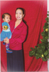 A photograph of So Meh with her youngest daughter during Christmas at St. Patrick's Church in Lowell, Massachusetts, 2015