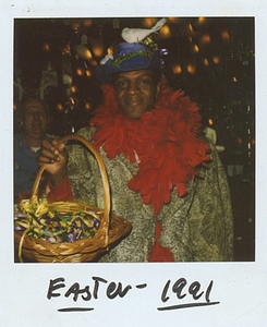 A Photograph of Marsha P. Johnson Wearing an Easter-Themed Hat with a Fake Bird on Top