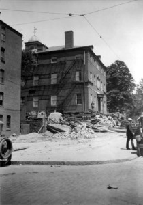 Exterior view of the Otis House during removal, as seen looking up Cambridge St., Boston, Mass., June, 1925