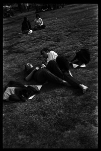 Crowd on Cambridge Common: couple lying on the grass
