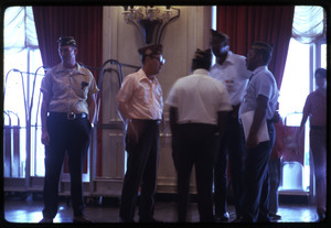 American Legionnaires talking in a hotel lobby
