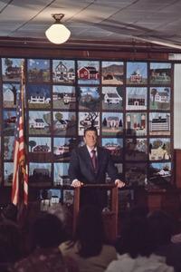 Ronald Reagan in front of patchwork quilt