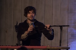 Matt Nakoa (keyboards) adjusting his microphone during a concert at the Payomet Performing Arts Center