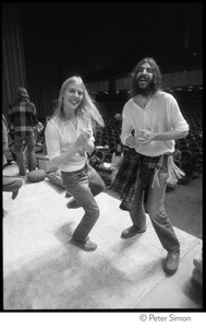 Couple dancing to the music on stage at the Kohoutek Festival of Consciousness