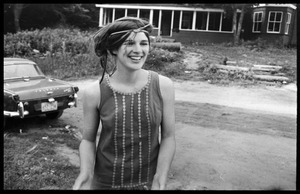 Cathy Rogers in front of the house, Montague Farm Commune