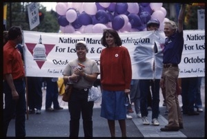 Newly-elected Congressional Representative Nancy Pelosi (red sweater) marching in the San Francisco Pride Parade in front of a banner for the National March on Washington for Lesbian and Gay Rights