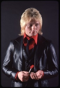 The Cars, photo shoot for Candy-O: Benjamin Orr holding a lollipop