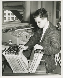 Frank Lettiere looking through files