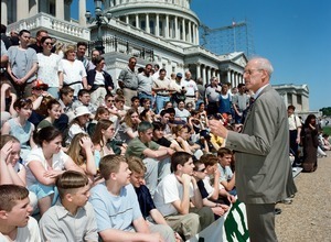 Congressman John W. Olver addressing of visitors seated on the steps of the United States Capitol building