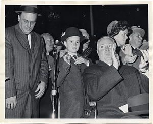 Mayor John F. Collins applauding at an event