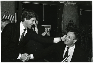 John Kerry shaking hands with Representative Barney Frank