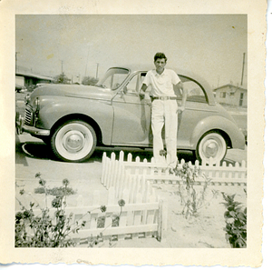 Albert Ares posing with car