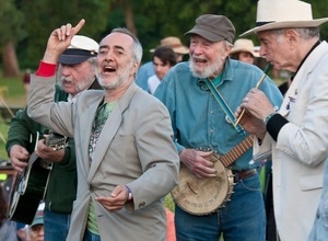 Raffi (finger raised) with Rick Knestler (guitar), Pete Seeger (banjo) and David Amram (tin whistle) during the closing ceremony at the Clearwater Festival