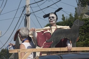Parade marchers dressed in a meat suit and dog's ears : Provincetown Carnival parade