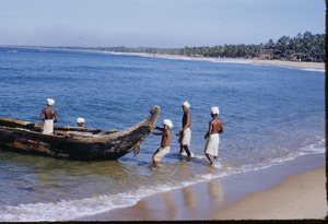 Men launching a fishing boat