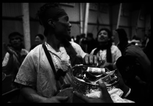Cambodian New Year's celebration: drummer and pot of money