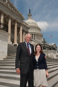 Congressman John W. Olver (center) with unidentified woman, posed on the steps of the United States Capitol building