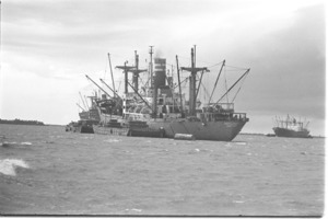 Freighter unloading ammunition at Cat Lay, Saigon River.