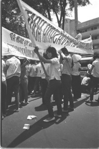 VIMYTEX (a textile mill) workers demonstrating in front of General Khanh's office for rehiring of fired workers; Saigon.