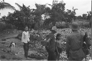 Farmer with bombed out home; Tay Ninh.