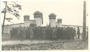 Group of men standing outside entrance to Pratt Field (1919)