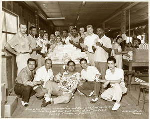 The Harlem Globetrotters and the New York Celtics at the La Perla Cigar and Cigarette Factory in Paranaque, Philippines on September 3, 1952.