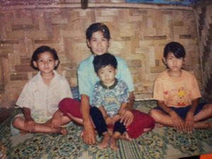 A photograph of Bo Meh's family in Karenni Camp #2 in Mae Surin, Thailand, 2003