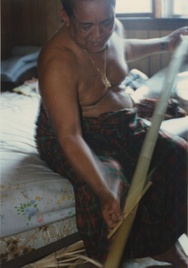 Basket Making: Em Yung measures the bamboo pole used to make the basket, 1987