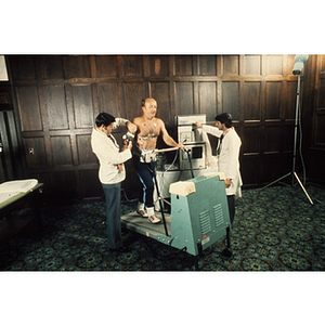 Man taking a cardiac stress test on a treadmill