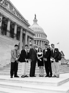 Congressman John W. Olver (center) with visitors, posed on the steps of the United States Capitol building