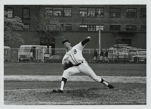 Tom Badcock pitching during a game
