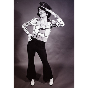 Press photo of Abe Rybeck posing with a hat and 70s attire