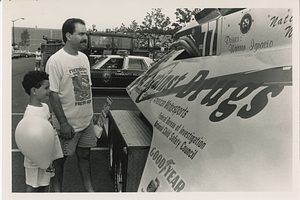 Bill and Jason Bettencourt look at boat named Race Against Drugs