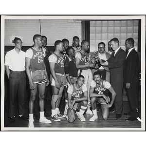 The Coasters team receives a trophy in the 1963 Boys' Clubs of Boston Basketball Tournament