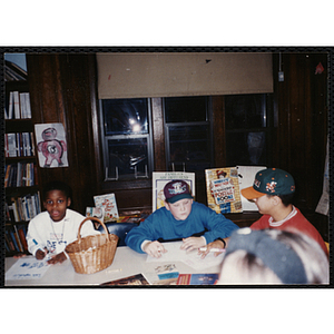 From left to right, Tony Pate, Tony Lopey, and Freddie Arroyo working on a project in a classroom