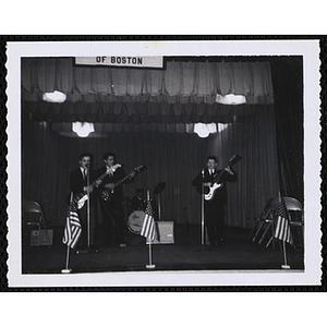 A band performs on the stage in the South Boston Clubhouse