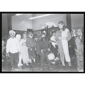 Children in costumes attend a Halloween event