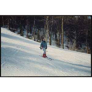 A teenage girl skis