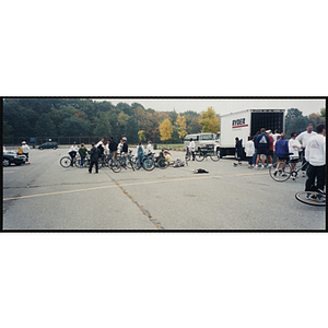 Adults and children congregate with their bikes in a parking lot for the Charlestown Bike Race