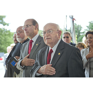 Dr. George J. Kostas says the pledge of allegiance at the groundbreaking ceremony for the George J. Kostas Research Institute for Homeland Security