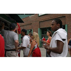 Michael Toney in front of a souvenir stand at Fenway Park