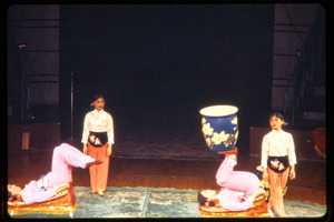 Shanghai acrobats: acrobats juggling a large vase on their feet