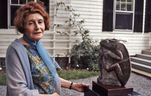 Grete Schuller with her sculpture of two lizards