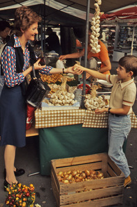 Woman buying garlic