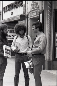 Free Spirit Press crew distributing their magazine on the street near M.J. Kittredge jewelry store