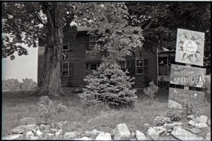 Brotherhood of the Spirit communal house, with signs in front reading "All people welcome" and "No drugs allowed"