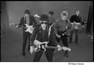 The Cars filming 'You Might Think': (l-r) Elliot Easton, Ric Ocasek, David Robinson, Benjamin Orr, and Greg Hawkes performing in front of a green screen